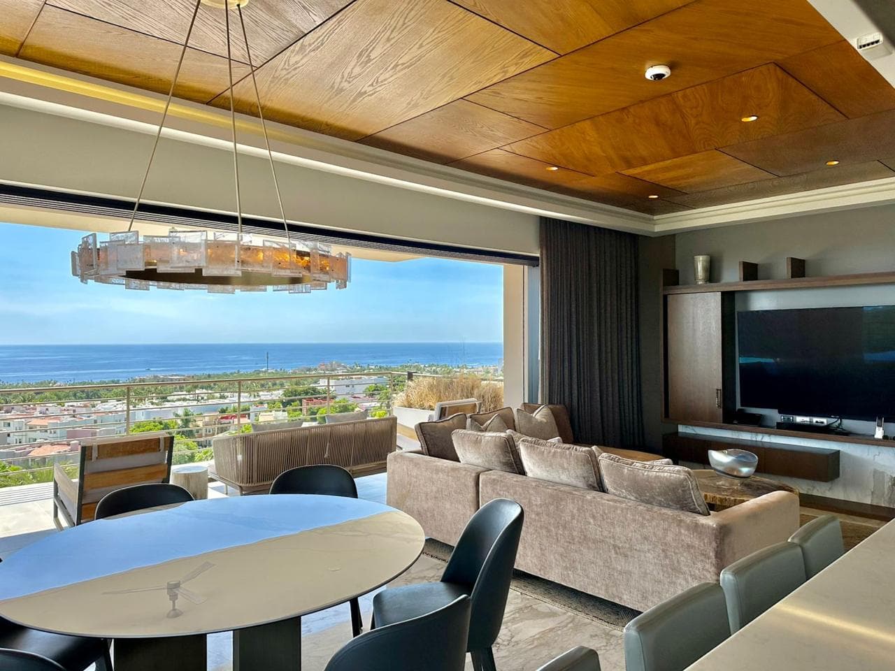 Living and dining area with ocean view.