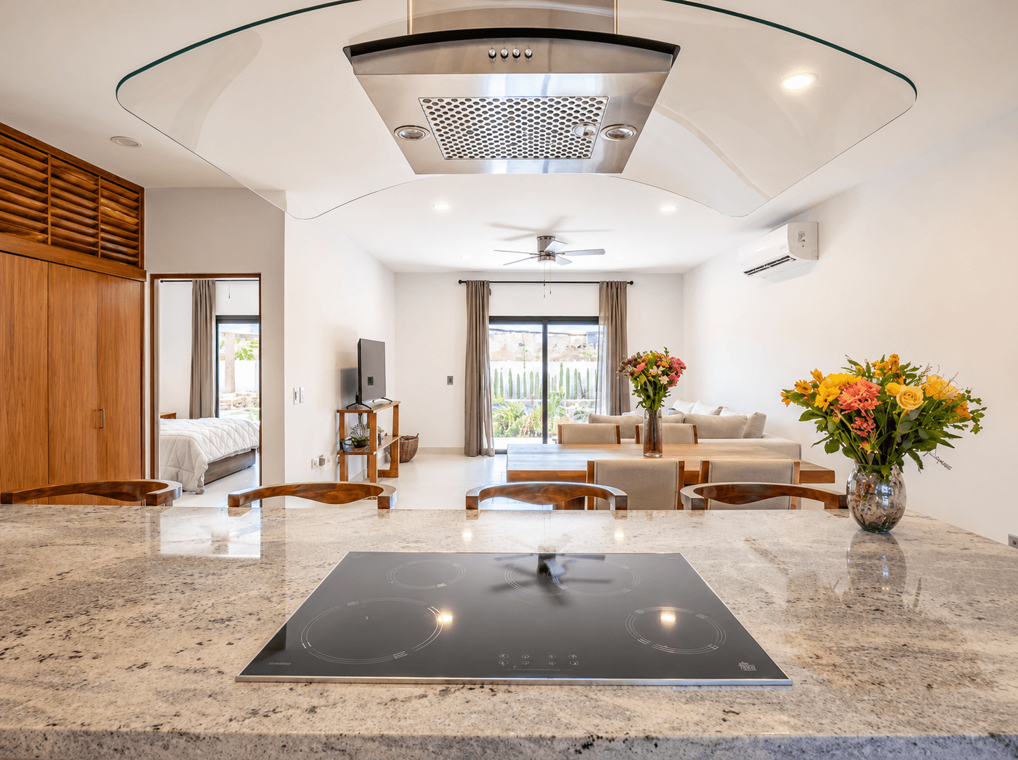 Open kitchen connecting seamlessly with the dining and living areas through an open layout.
