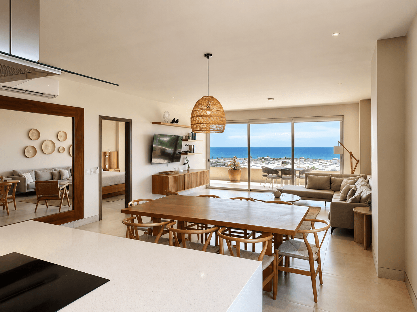 Living room, dining area and kitchen with Arch views.