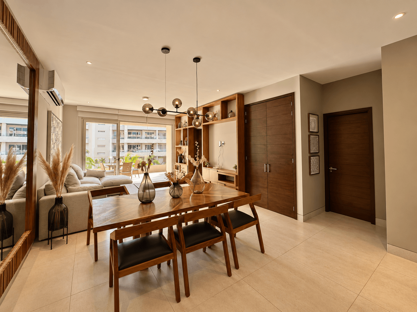 Dining and living area with terrace access.