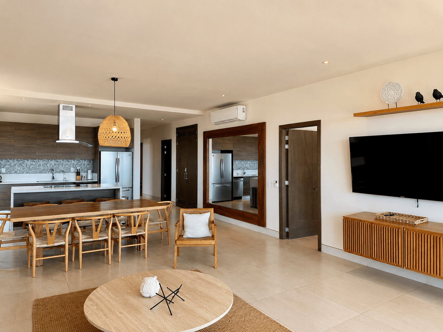 Living and dining area with wood finishes.