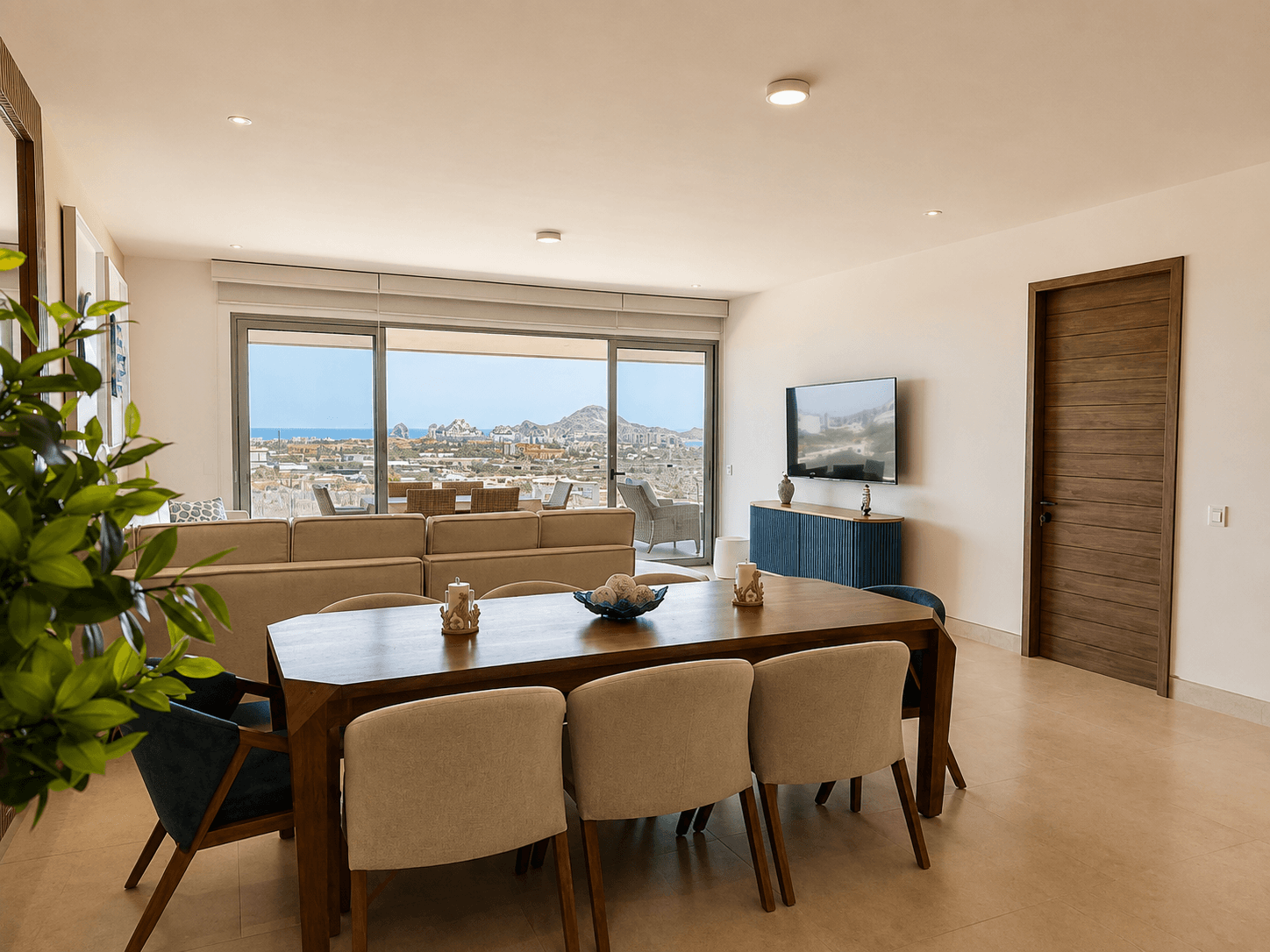 Dining and living area with ocean and Arch views."